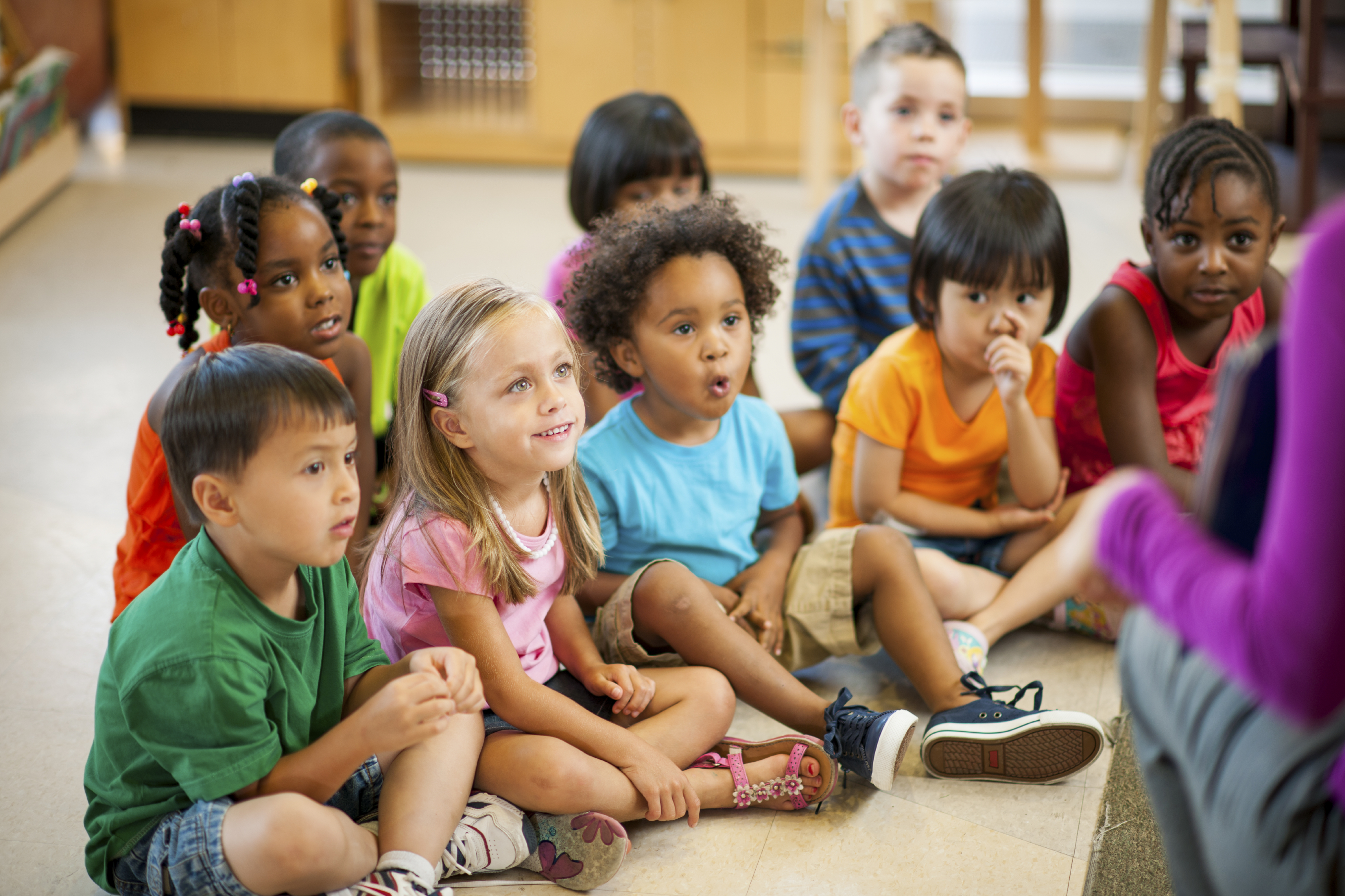 Multi ethnic group of pre-school children in a classroom.